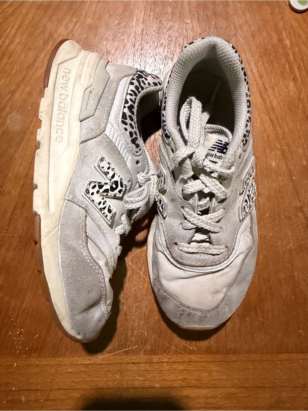 New Balance white sneakers with leopard print accents